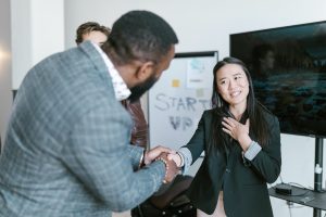 A man showing gratitude towards a woman who is showing she is thankful - Twelve and a Half Emotional Ingredients Necessary for Business Success